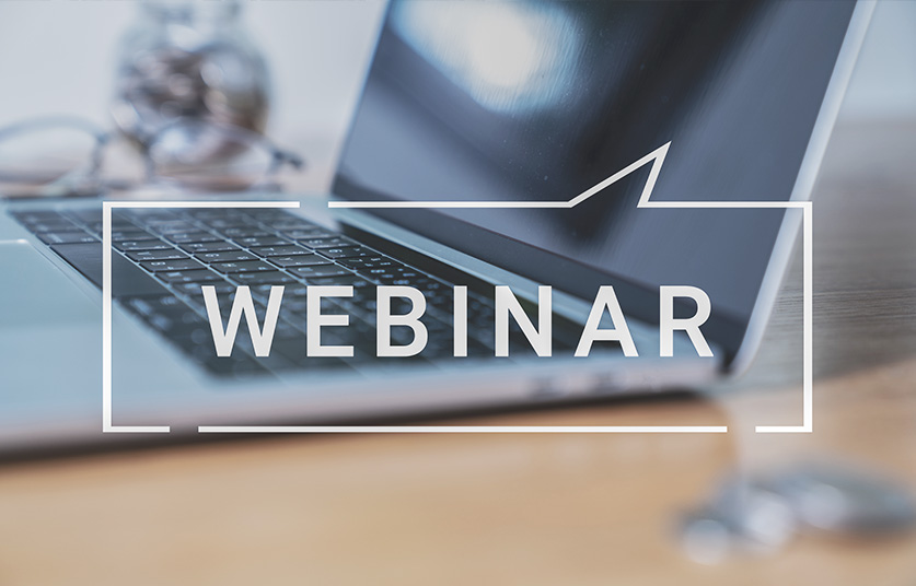 Webinar Sprechblase mit Laptop im Hintergrund