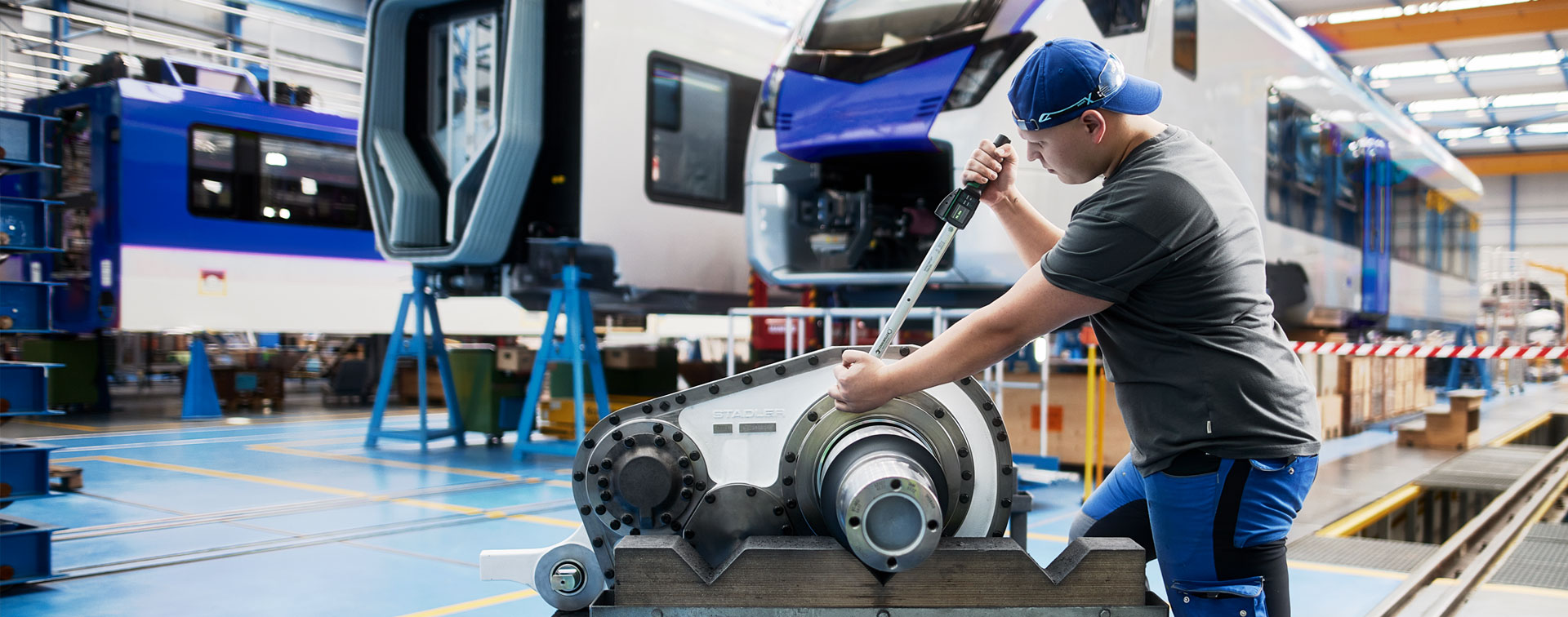 A worker using a DAPTIQ® torque wrench for a bolted joint