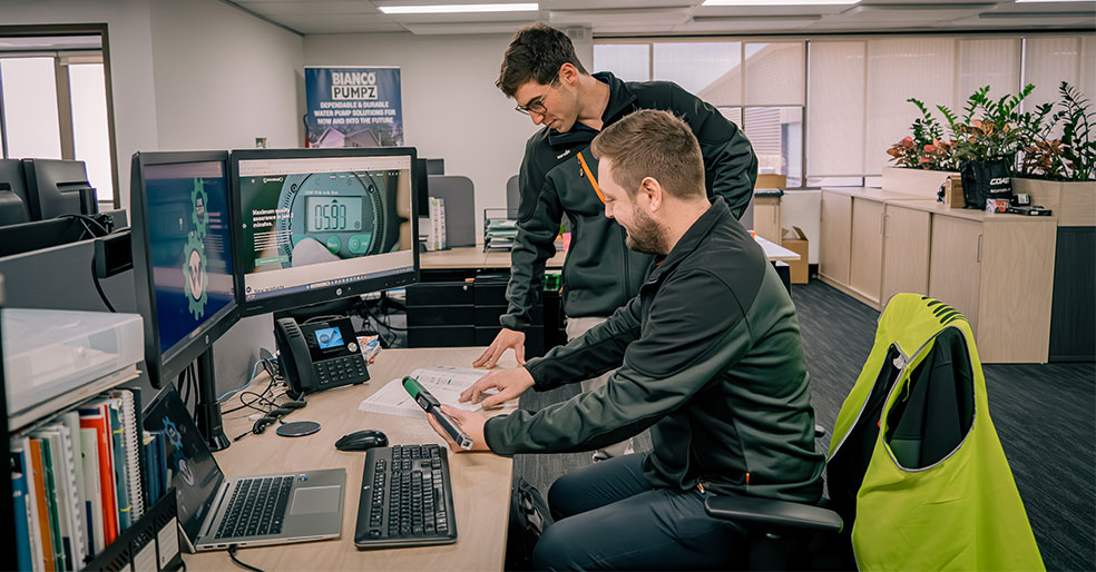 Wind power specialist at their desk.